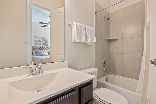 full bathroom with shower / bath combo with shower curtain, vanity, toilet, and ceiling fan