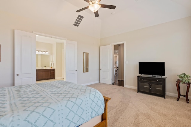 carpeted bedroom with connected bathroom, ceiling fan, and high vaulted ceiling