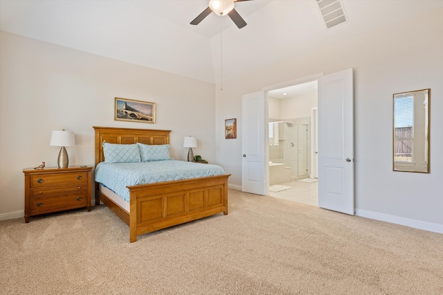 bedroom with ensuite bathroom, ceiling fan, and light colored carpet