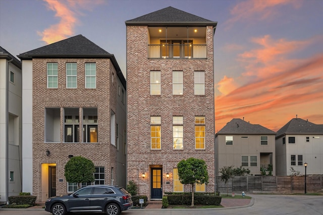 view of front of property with a balcony