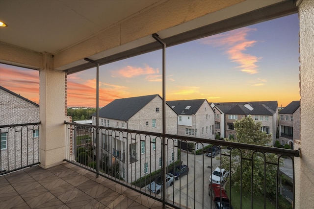 view of balcony at dusk