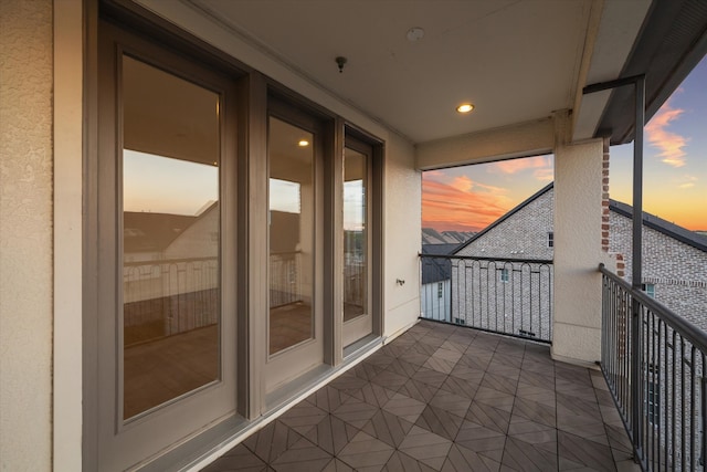 view of balcony at dusk