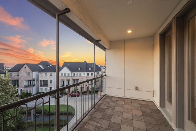 view of balcony at dusk