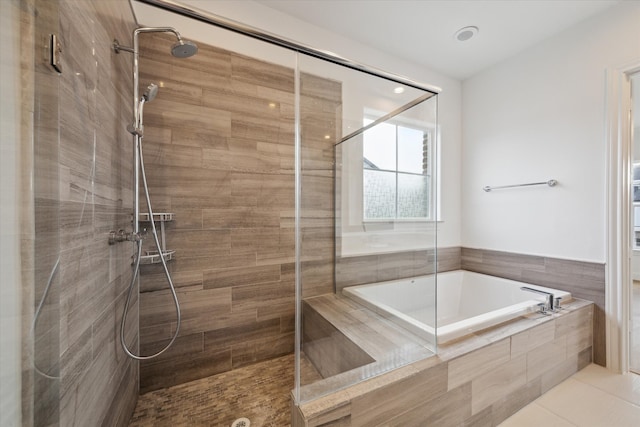 bathroom with plus walk in shower and tile patterned floors