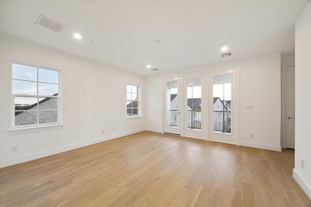 unfurnished room featuring light wood-type flooring