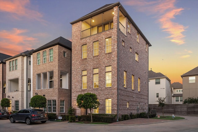 view of outdoor building at dusk