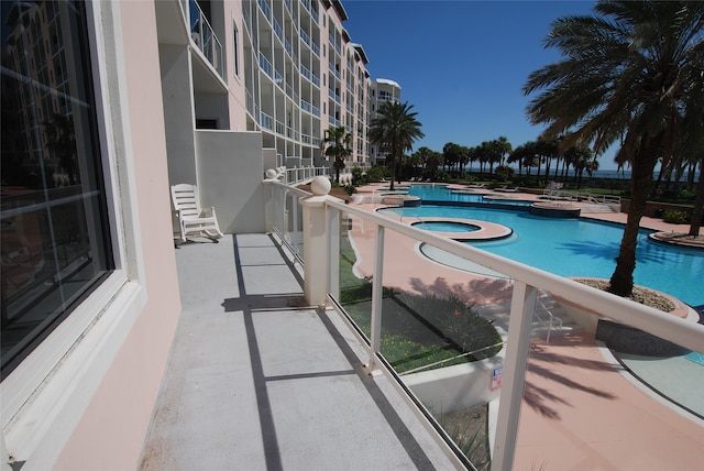 view of pool with a patio and a community hot tub