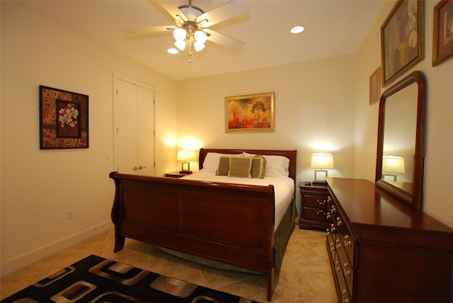 tiled bedroom with ceiling fan