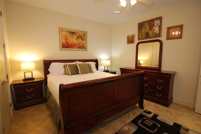 tiled bedroom with ceiling fan