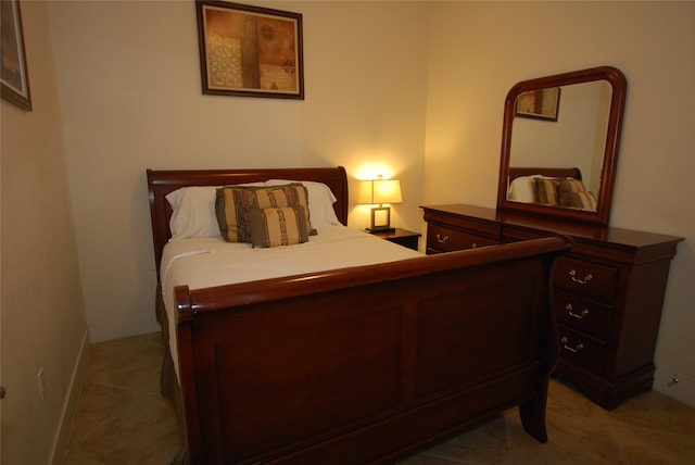 bedroom with light tile patterned flooring