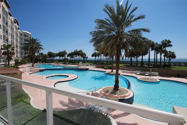 view of pool featuring a patio and a community hot tub