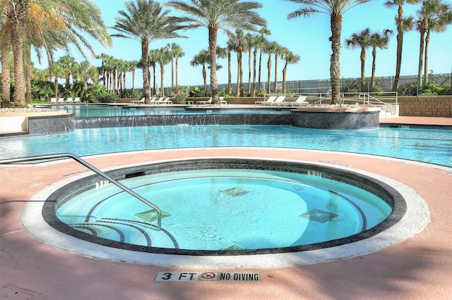 view of pool featuring a hot tub