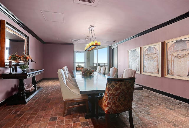 dining area featuring crown molding