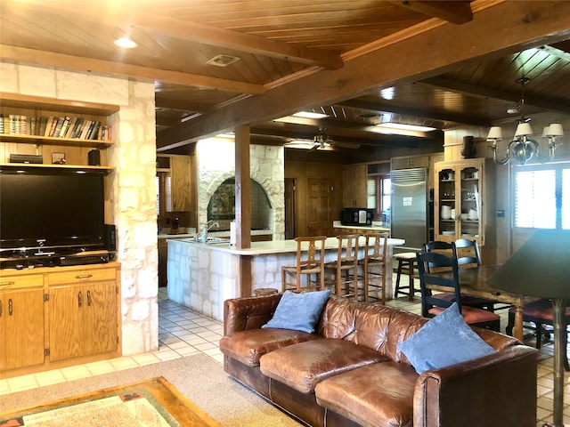 living room featuring wooden ceiling, light tile patterned floors, beam ceiling, and ceiling fan