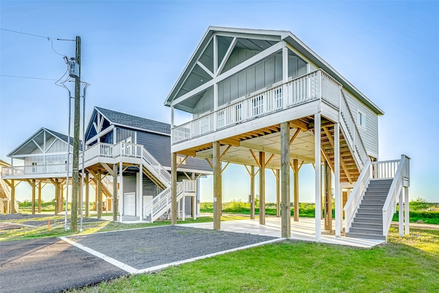 exterior space featuring a wooden deck and a lawn