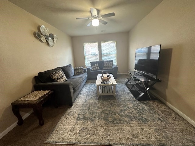 carpeted living room featuring ceiling fan