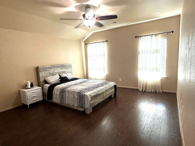 bedroom featuring ceiling fan, vaulted ceiling, and dark hardwood / wood-style flooring