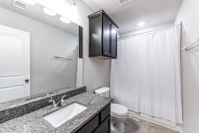 full bathroom featuring shower / tub combo, tile patterned flooring, vanity, and toilet