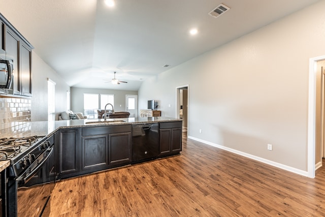 kitchen featuring hardwood / wood-style flooring, sink, lofted ceiling, black appliances, and ceiling fan