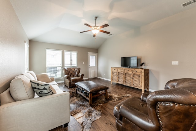 living room featuring vaulted ceiling, ceiling fan, and dark hardwood / wood-style floors