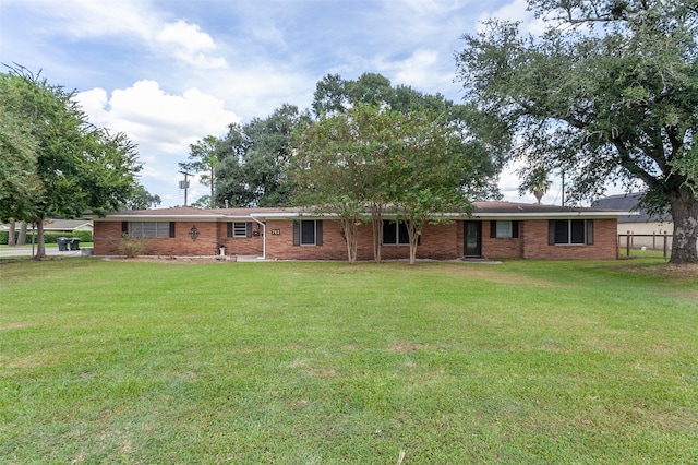 back of house with a lawn