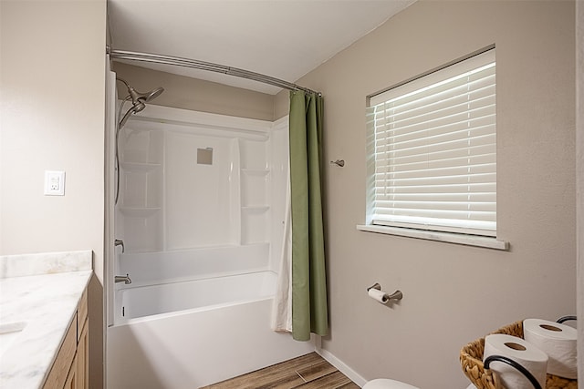 bathroom with vanity, hardwood / wood-style flooring, and shower / bath combo