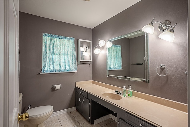 bathroom featuring vanity, toilet, and tile patterned floors