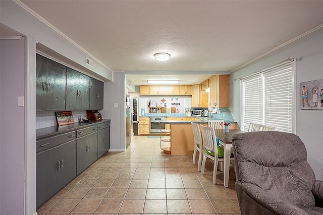 kitchen with ornamental molding, stainless steel appliances, decorative backsplash, and light tile patterned flooring