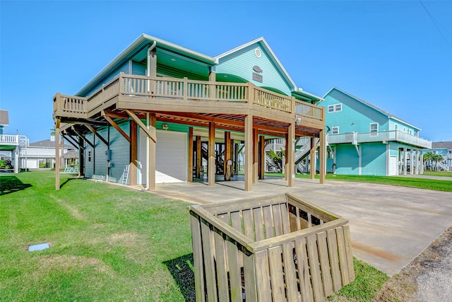 exterior space featuring a yard, a garage, and a wooden deck