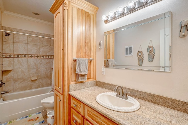 full bathroom featuring toilet, vanity, crown molding, and shower / bathing tub combination