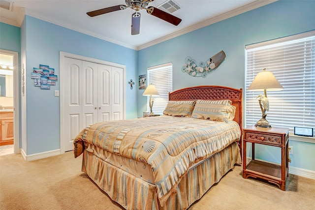 bedroom featuring light carpet, baseboards, a closet, and visible vents
