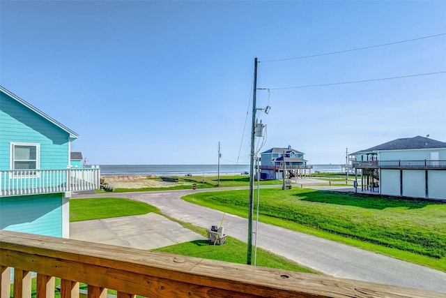 exterior space featuring a water view and a yard