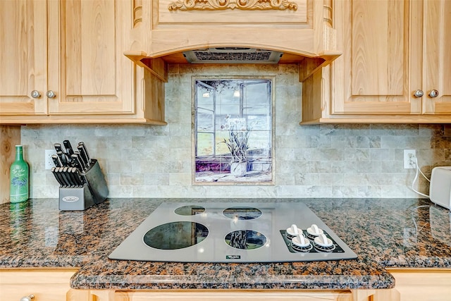 kitchen featuring tasteful backsplash, light brown cabinetry, custom exhaust hood, and white electric stovetop