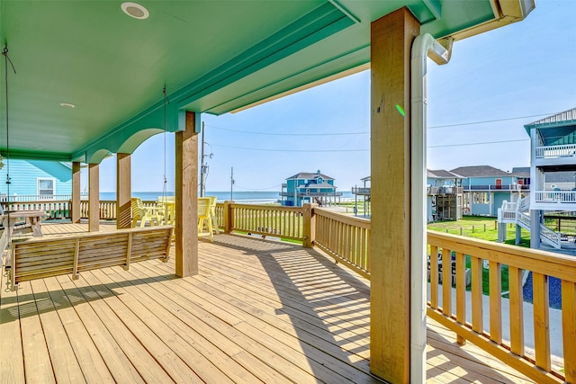 wooden terrace with a water view