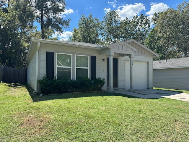 single story home featuring a front yard and a garage