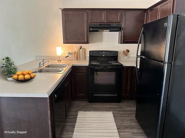 kitchen featuring dark hardwood / wood-style flooring, sink, dark brown cabinetry, and black appliances