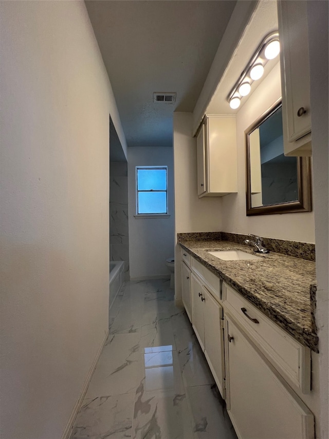 bathroom with vanity and toilet