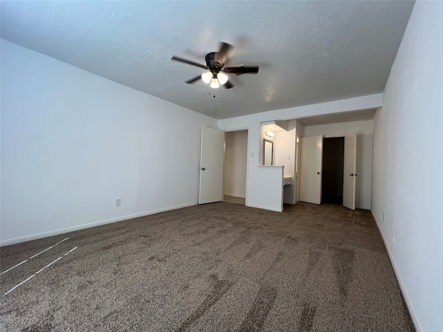 unfurnished bedroom featuring carpet, ceiling fan, and a textured ceiling