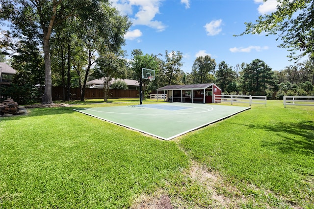 view of basketball court featuring a lawn