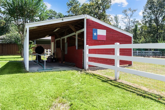 view of outdoor structure with a yard