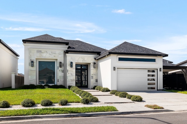 view of front facade featuring a front yard and a garage