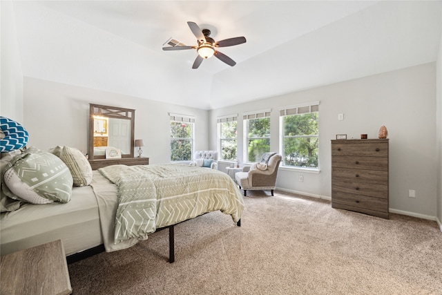 bedroom with ceiling fan, carpet floors, and vaulted ceiling