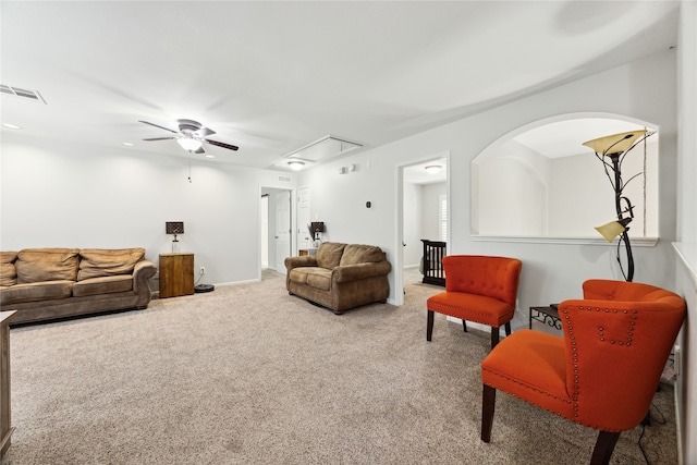 carpeted living room featuring ceiling fan