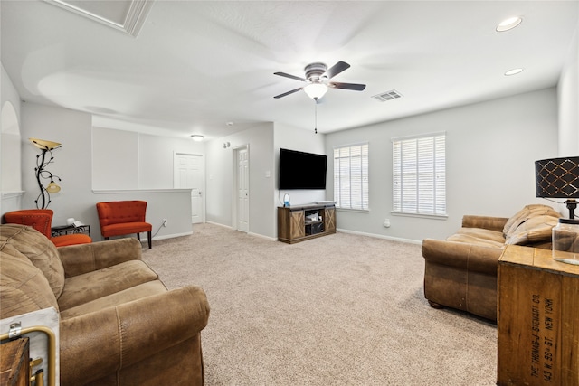 living room featuring ceiling fan and light carpet