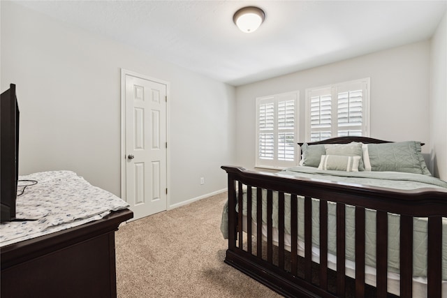 bedroom featuring light colored carpet