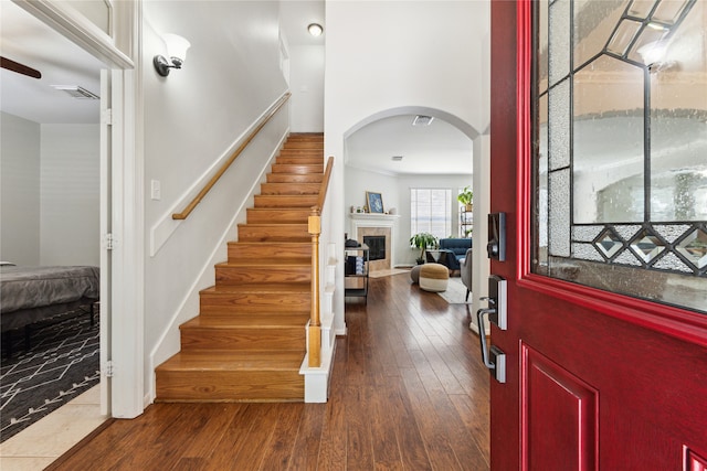 entrance foyer with dark hardwood / wood-style flooring and ceiling fan