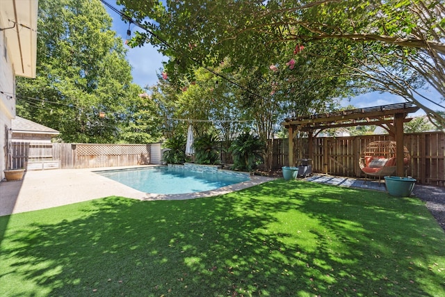 view of swimming pool featuring a yard and a patio area