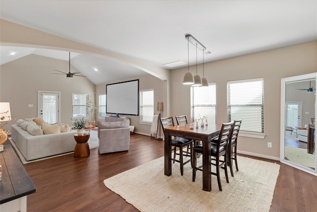 dining room with dark wood-type flooring, ceiling fan, and lofted ceiling