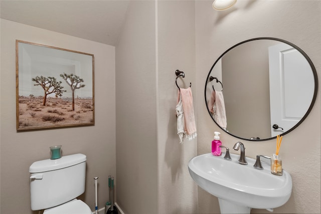 bathroom featuring sink and toilet