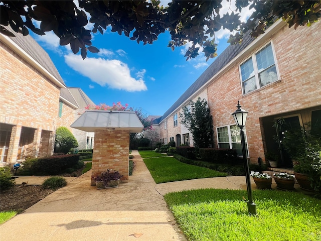 view of home's community featuring a yard